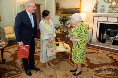 Queen Elizabeth II meets Australian Prime Minister Scott Morrison and his wife Jennifer during a private audience at Buckingham Palace, in London. Reuters