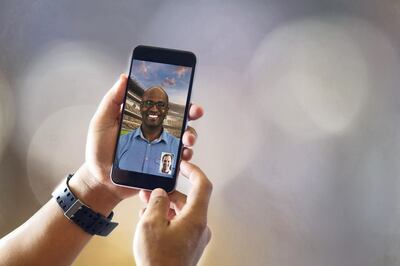 Close up of man with smartphones with blurred background. Communication and Technology Concept.