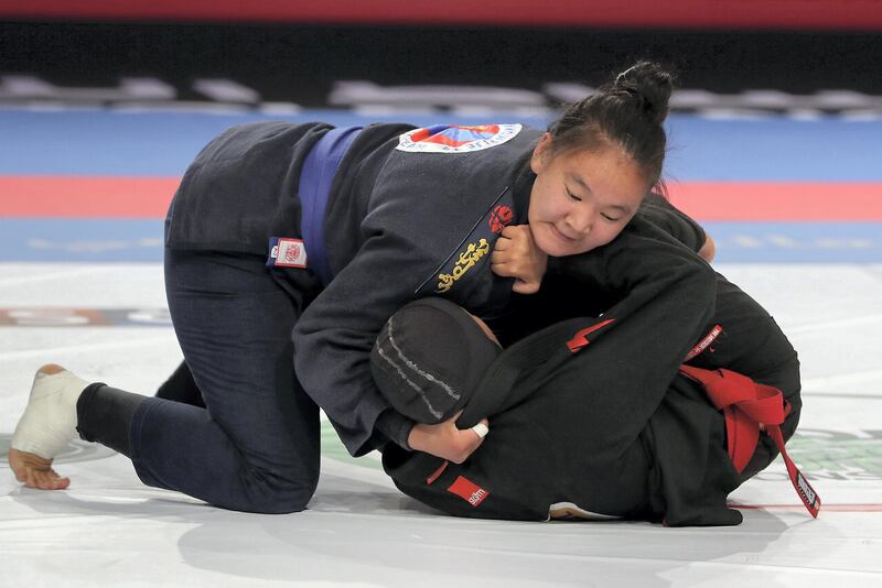 ABU DHABI,  UNITED ARAB EMIRATES , April 21 – 2019 :- Shamsa Gharebi ( red from UAE Al Wahda Club Jiu Jitsu Academy ) vs Khulan Batmunkh ( blue from Khilchin won) during the final of 70kg category   in the Abu Dhabi World Professional Jiu Jitsu  Championship 2019 held at the Mubadala Arena in Abu Dhabi. Khulan blue won the fight. ( Pawan Singh / The National ) For Sports. Story by Amith