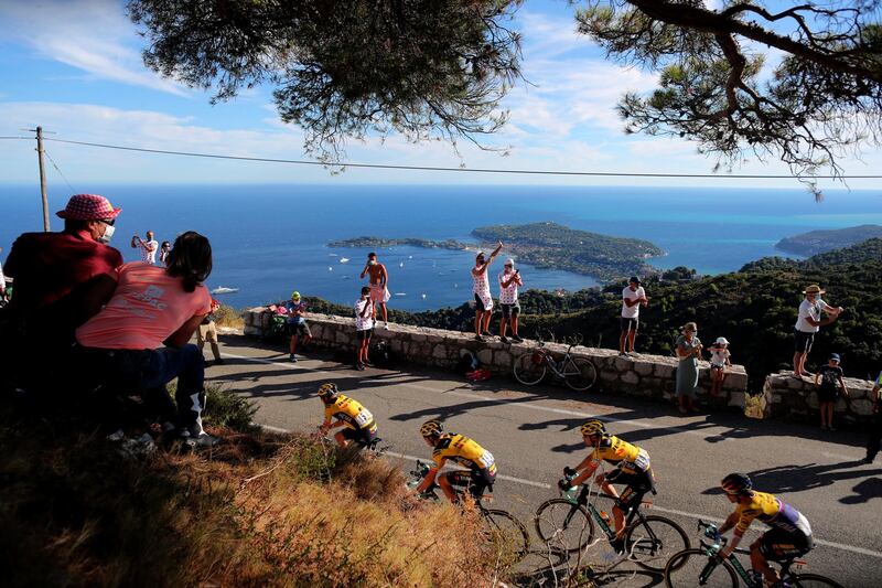 Spectators watch the riders pass through Eze near Nice during Stage 2. AP