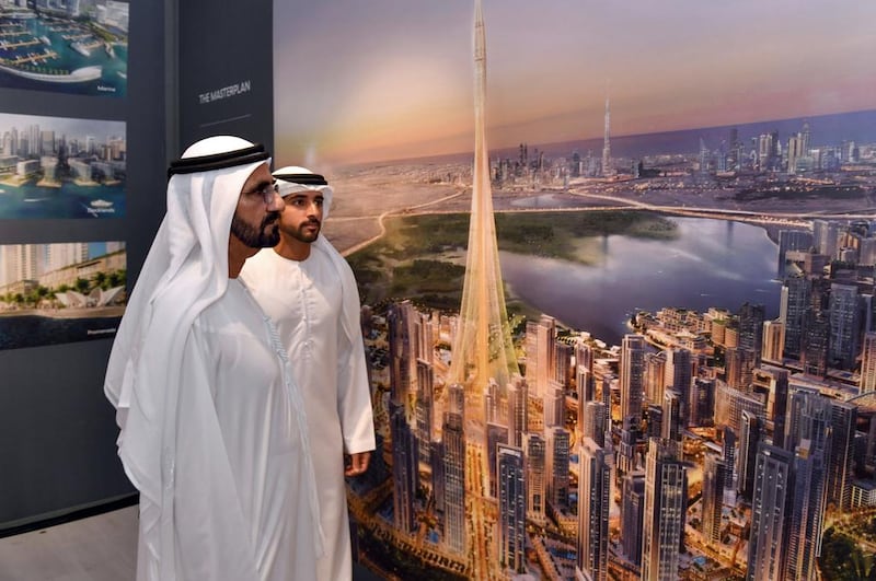 Sheikh Mohammed bin Rashid, the Vice President and Ruler of Dubai, and Sheikh Hamdan bin Mohammed bin Rashid, the Dubai Crown Prince, look at an illustration of the  "The Tower at Dubai Creek Harbour". WAM