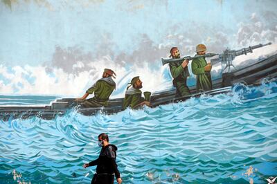 A mural, depicting members of the Islamic Revolutionary Guard Corps in the waters of the Arabian Gulf, in Tehran. EPA