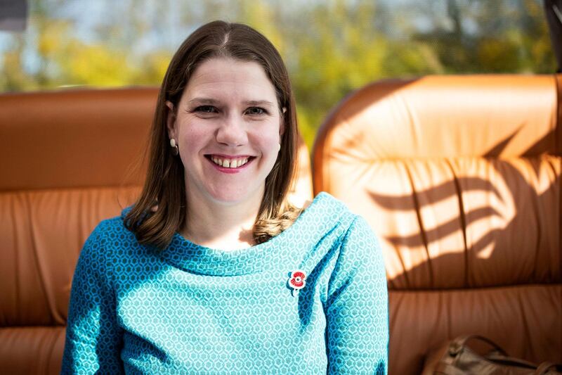 Britain's Liberal Democrat Leader Jo Swinson poses for a photograph at the back of her campaign bus on the way to Midsomer Norton for her first engagement as part of the General Election campaign trail, in Somerset, England, Thursday, Nov. 7, 2019. Britain goes to the polls on Dec. 12.  (Aaron Chown/PA via AP)