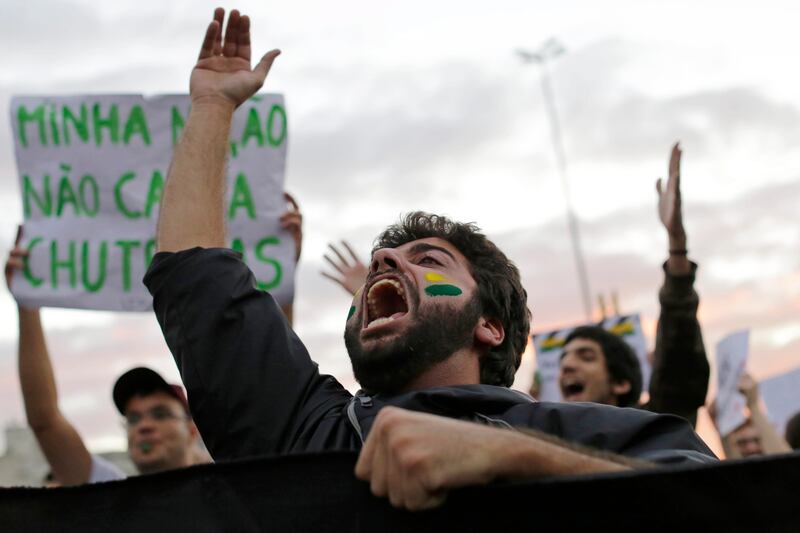 A demonstrator shouts during a protests in Sao Paulo, Brazil, Monday, June 17, 2013. Protesters massed in at least seven Brazilian cities Monday for another round of demonstrations voicing disgruntlement about life in the country, raising questions about security during big events like the current Confederations Cup and a papal visit next month. (AP Photo/Nelson Antoine) *** Local Caption ***  Brazil Confed Cup Protests.JPEG-04d4a.jpg