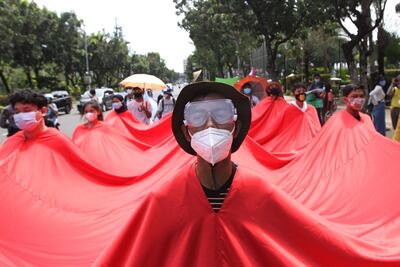 Activists take part in a climate change rally in Jakarta on November 27, 2020. / AFP / Dasril Roszandi
