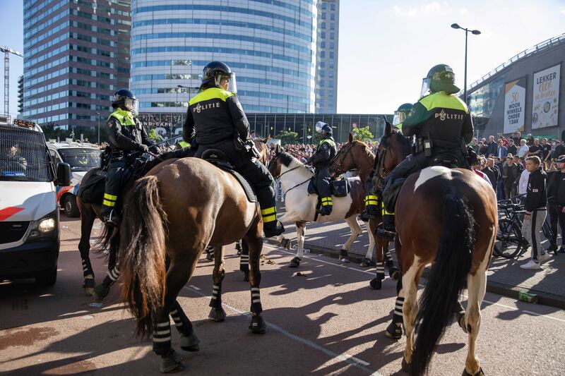 Riot police are deployed around the Johan Cruyff Arena after the Dutch Eredivisie match between Ajax and Feyenoord. EPA
