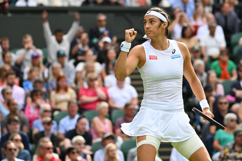 Caroline Garcia celebrates during the match against Emma Raducanu. AFP