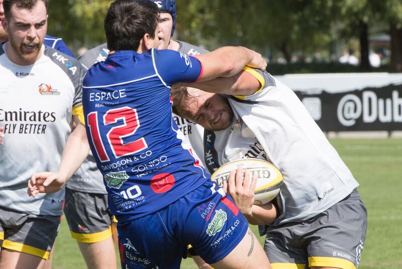 Dubai Hurricanes (grey/white shirts) take on Jebel Ali Dragons at The Sevens Stadium in Dubai. Ruel Pableo for The National