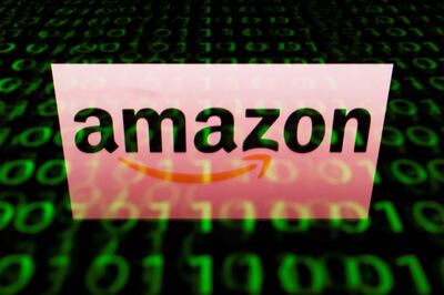 (FILES) A file illustration picture taken on April 29, 2018, shows the logo of Amazon displayed on a screen and reflected on a tablet in Paris. - Amazon became the second big US company to hit $1 trillion in stock market value in the latest demonstration of the rising clout of American technology heavyweights September 4, 2018. The online retail giant breached the $1 trillion valuation near 1540 GMT when it's share price hit $2,050.50. The Amazon landmark comes about a month after Apple hit the $1 trillion level. (Photo by Lionel BONAVENTURE / AFP)