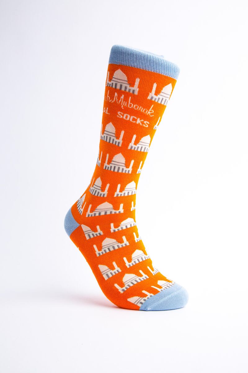 The Jummah Mubarak sock: “Every Friday, men go to the mosque for prayer. During this time, they stand next to one another in unity. And the orange background is simply to brighten their day!”