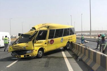 The aftermath of an traffic accident involving a school bus in Abu Dhabi in June 2018. Police across the country are urging people to take extra care when pupils return to school on September 2