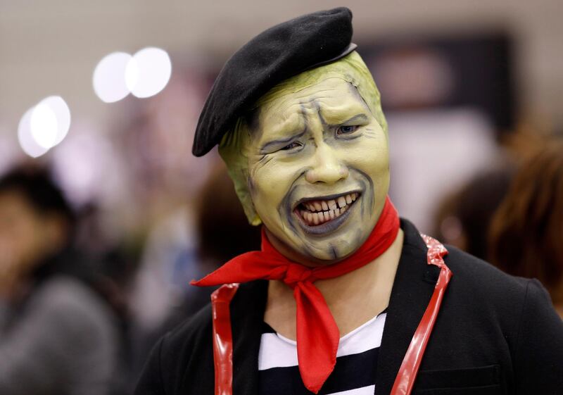 A cosplayer doesn't smile for the camera. EPA