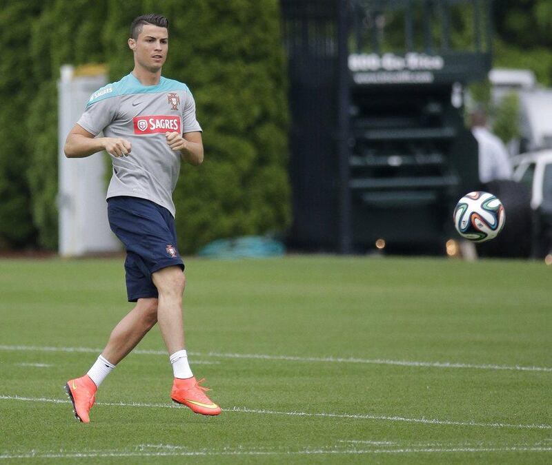 Cristiano Ronaldo shown working toward fitness for the 2014 World Cup at the New York Jets' training facility on Tuesday. Ray Stubblebine / Reuters / June 3, 2014