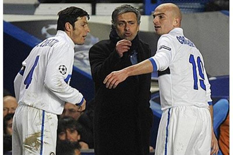 Inter Milan manager Jose Mourinho, centre, instructs his players Javier Zanetti, left, and Esteban Cambiasso during the match at Stamford Bridge.