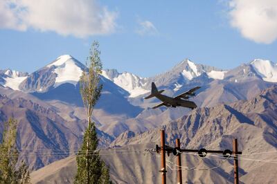 An Indian Air Force Hercules military transport plane prepares to land at an airbase in Leh, the joint capital of the union territory of Ladakh bordering China, on September 8, 2020. China on September 8 said its troops were forced to take "countermeasures" after Indian soldiers crossed their tense Himalayan border and opened fire. The relationship between the two nuclear-armed neighbours has deteriorated since a clash in the Ladakh region on June 15 in which 20 Indian troops were killed. / AFP / Mohd Arhaan ARCHER
