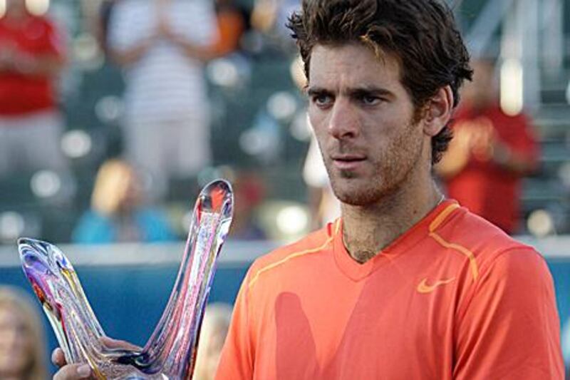 Juan Martin del Potro holds his trophy after defeating Janko Tipsarevic 6-4, 6-4 to win the Delray Beach International Tennis Championships.