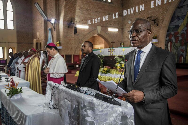 Congolese opposition leader and presidential candidate Martin Fayulu addresses the congregation at the Notre-Dame-de-Kinshasa cathedral in Kinshasa while attending a religious service on December 29, 2018. / AFP / MARCO LONGARI
