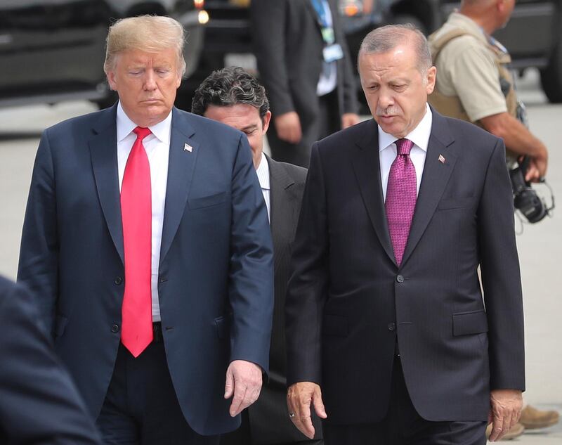 epa06943394 (FILE) - US President Donald J. Trump (L) and Turkey's President Recep Tayyip Erdogan (R) arrive for a family picture of Nato Summit in Brussels, Belgium, 11 July 2018 (reissued 11 August 2018). Turkish President Erdogan condemned US President Trump's doubling of tariffs on Turkish steel and aluminium imports up to 50 percent. The Turkish lira plunged over 20 percent against the US dollar after Trump's announcement on 10 August 2018, which has been exacerbated over the disputed imprisonment of US pastor Andrew Brunson in Turkey.  EPA/OLIVIER HOSLET