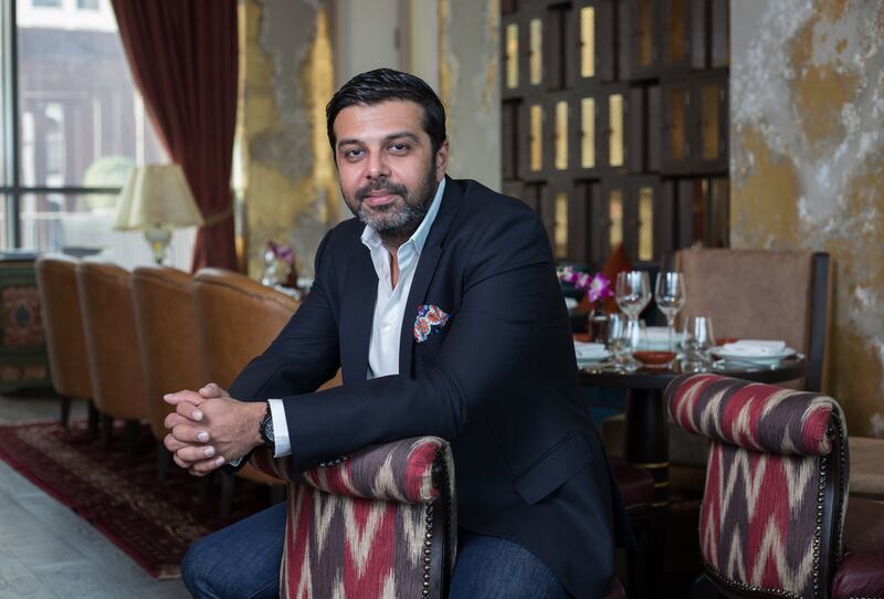 Girish Mahtani, the founder of Nine Stars International, pictured at Coya with some of his company’s furniture. Victor Besa for The National