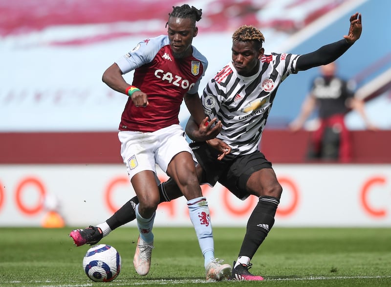Villa's Bertrand Traore under pressure from Paul Pogba of Manchester United at Villa Park. EPA