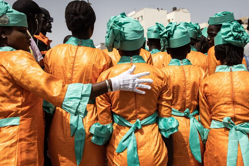 School girls get ready to take part in celebrations for Senegal’s 63rd Independence Day in Dakar. AFP