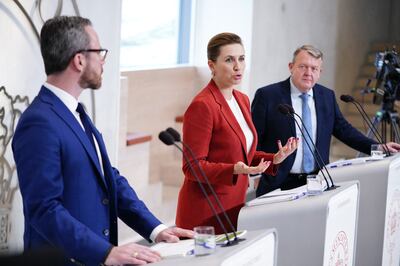 Danish Prime Minister Mette Frederiksen, centre, with her new coalition partners Jakob Ellemann-Jensen and Lars Lokke Rasmussen. AFP 