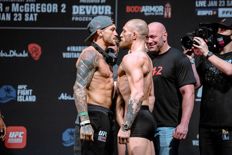 Dustin Poirier vs. Conor McGregor 2 weigh-in staredown.  Getty Images