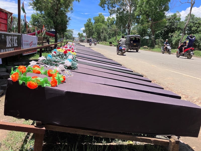 Empty coffins line a road in Churachandpur district as a symbol to remember Christian Kukis killed in the clashes