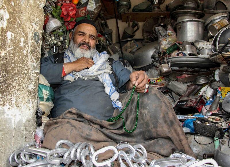 A man waits for customers at his shop in Kandahar, Afghanistan, April 15. EPA