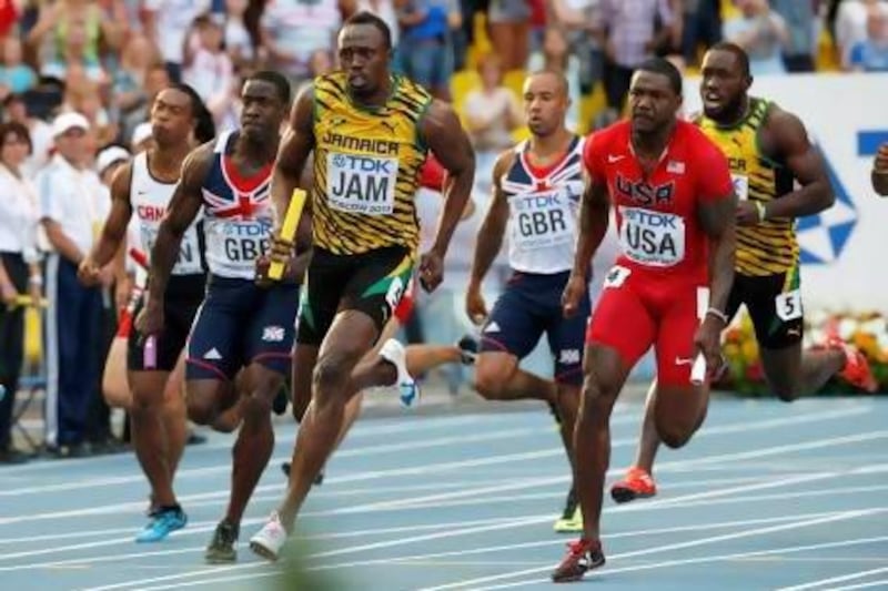 Jamaica's Usain Bolt anchors his team to gold in the men's 4x100m relay.