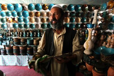 June 6, 2008 / Istalif /  Malik Mohammad owns this pottery shop in Istalif Afghanistan. During the Telaban's rule pottery shops in Istalif where destroyed, but with the help of the Turquoise Mountain Foundation the shops have returned June 6, 2008. (Sammy Dallal / The National) *** Local Caption ***  sd-afghanday4-3.jpg sd-afghanday4-3.jpgrv20afghanarts8.jpg