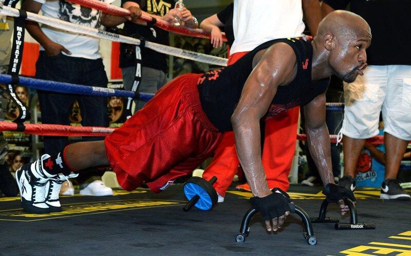 Floyd Mayweather does pushups during training on Tuesday at his Mayweather Boxing Club in Las Vegas. Ethan Miller / Getty Images / AFP / April 22, 2014