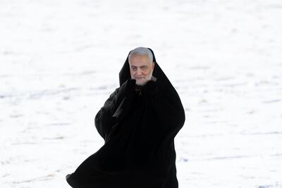 An Iranian holds up a picture of Gen. Qassem Soleimani during a rally at Azadi (Freedom) Square celebrating the 41st anniversary of the Islamic Revolution, in Tehran, Iran, Tuesday, Feb. 11, 2020. Iranians took to the streets of Tehran and other cities and towns across the country on Tuesday for rallies and nationwide celebrations marking the anniversary of the 1979 Islamic Revolution when followers of Ayatollah Khomeini ousted U.S.-backed Shah Mohammad Reza Pahlavi. (AP Photo/Ebrahim Noroozi)