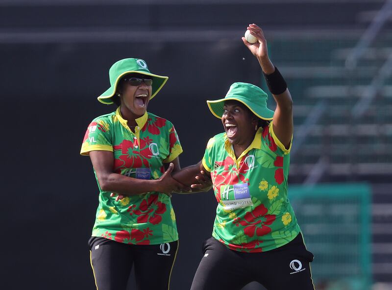 Vanuatu's Rachel Andrew celebrates after catching out UAE batter Kavisha Egodage for 17 off the bowling of Vanessa Vira