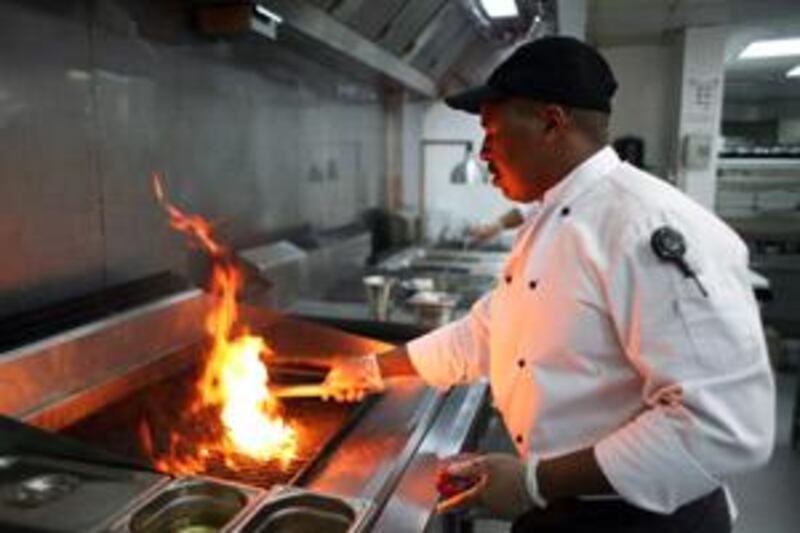 Great Mabuzza prepares steak at the Downtown Grill.
