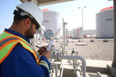 An employee is pictured working at the Bin Omar natural gas station, north of the southern Iraqi port of Basra. AFP