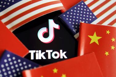 China and US flags are seen near a TikTok logo in this illustration picture taken July 16, 2020. REUTERS