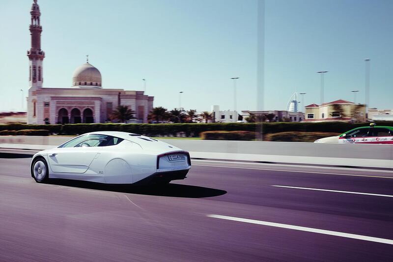 The Volkswagen XL1 on the streets of Dubai. Its hybrid technology and carbon-fibre build combine to make it the world's most fuel efficient car. Courtesy Volkswagen.