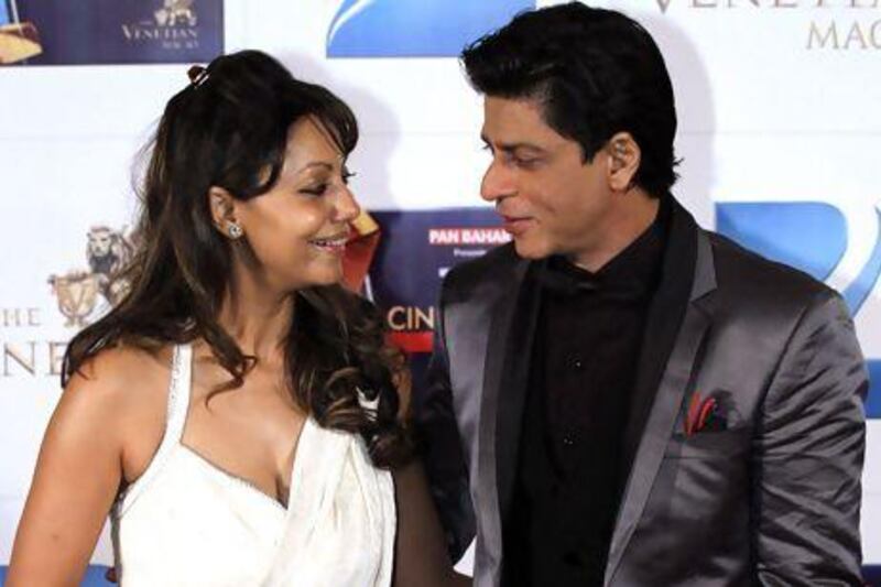 Shah Rukh Khan with his wife Gauri. Khan confirmed that they are parents of a new baby boy who was conceived through a surrogate. Kin Cheung / AP Photo
