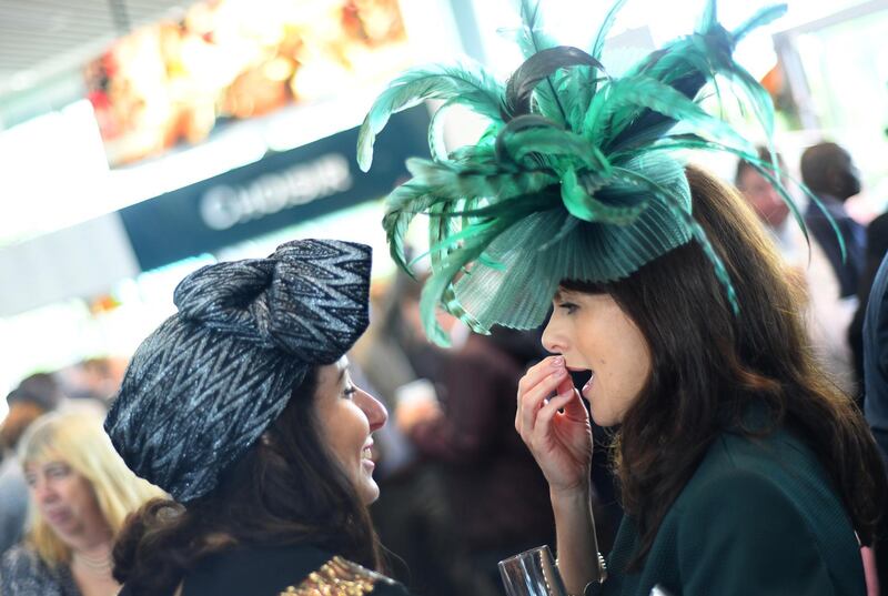 A wrapped turban versus a feathered fascinator, at Royal Ascot. Getty