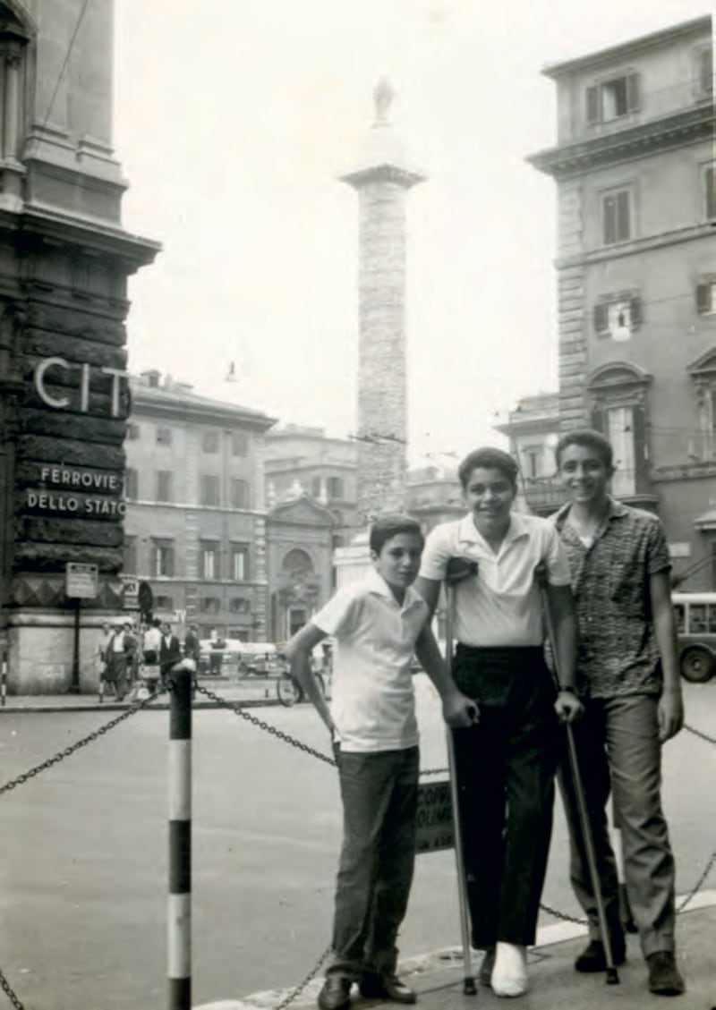 Mr Mansour on crutches during a vacation in Europe, circa 1962, with his brothers. Photo: Hawthorn