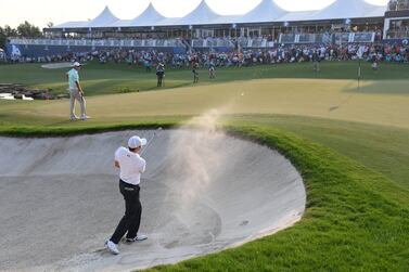 Matt Fitzpatrick hits his third shot on the 18th hole during the final round of the DP World Tour Championship. Ross Kinnaird / Getty Images