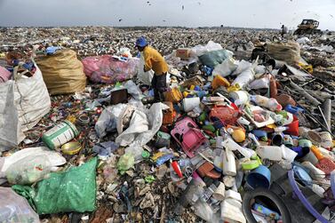 A man collects plastic for recycling at a dumpsite in Colombo, Sri Lanka. Reuters