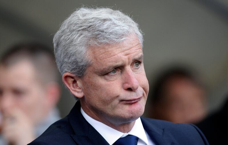 Queens Park Rangers manager Mark Hughes takes his seat before his team's English Premier League soccer match against Manchester City at The Etihad Stadium, Manchester, England, Saturday, Sept. 1, 2012. (AP Photo/Jon Super) *** Local Caption ***  Britain Soccer Premier League.JPEG-09aa2.jpg