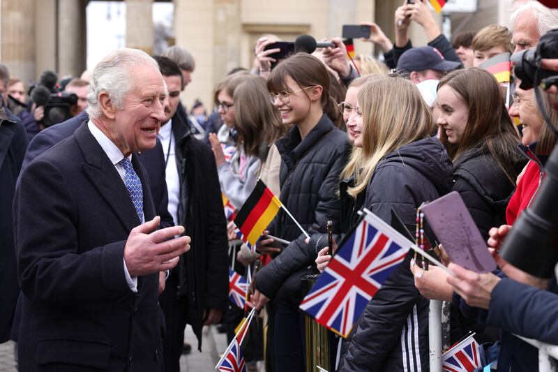 King Charles III chats with well-wishers at Berlin's Brandenburg Gate, during his first visit to Germany as King. EPA