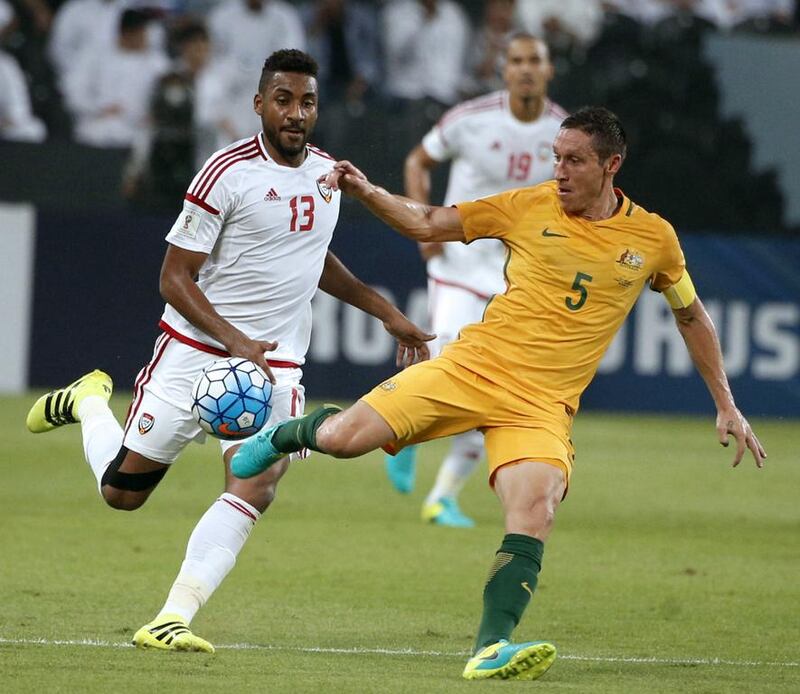 The UAE’s Khamis Ismail, left, vies with Australia’s Trent Sainsbury. Karim Sahib / AFP