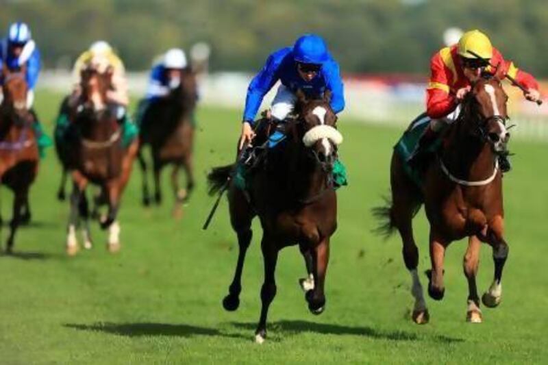 Certify, left, ridden by Michael Barzalona beats Purr Along to win the Barrett Steel May Hill Stakes during the Ladbrokes St Leger Festival at Doncaster Racecourse.