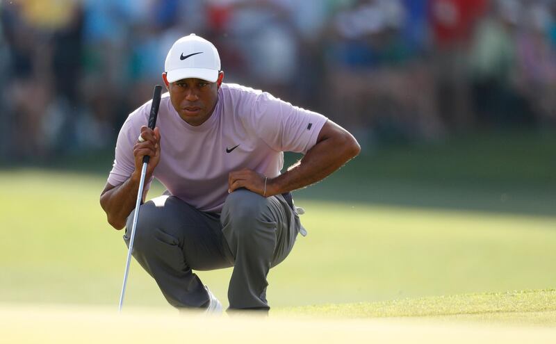 epa07505079 Tiger Woods of the US lines up his putt on the seventeenth hole during the third round of the 2019 Masters Tournament at the Augusta National Golf Club in Augusta, Georgia, USA, 13 April 2019. The 2019 Masters Tournament is held 11 April through 14 April 2019.  EPA/JUSTIN LANE