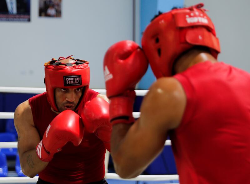 Abdelrahman Orabi, known as 'The Rock', attends a training session with his coach 'Olesius' from Cuba in Egypt ahead of the Olympic Games in Tokyo.