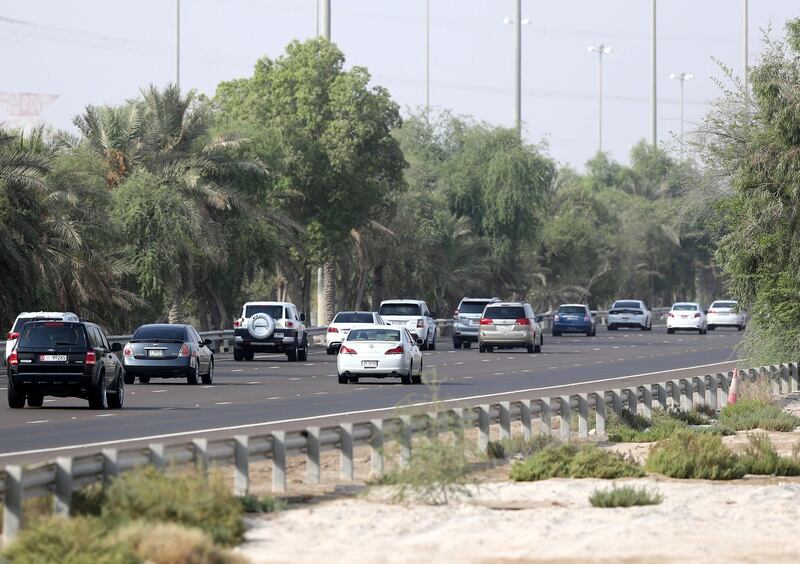 Abu Dhabi, United Arab Emirates - August 12, 2018: Morning commuters head from Dubai towards Abu Dhabi on the first day of no speed buffer. Sunday, August 12th, 2018 on E11, Abu Dhabi. Chris Whiteoak / The National